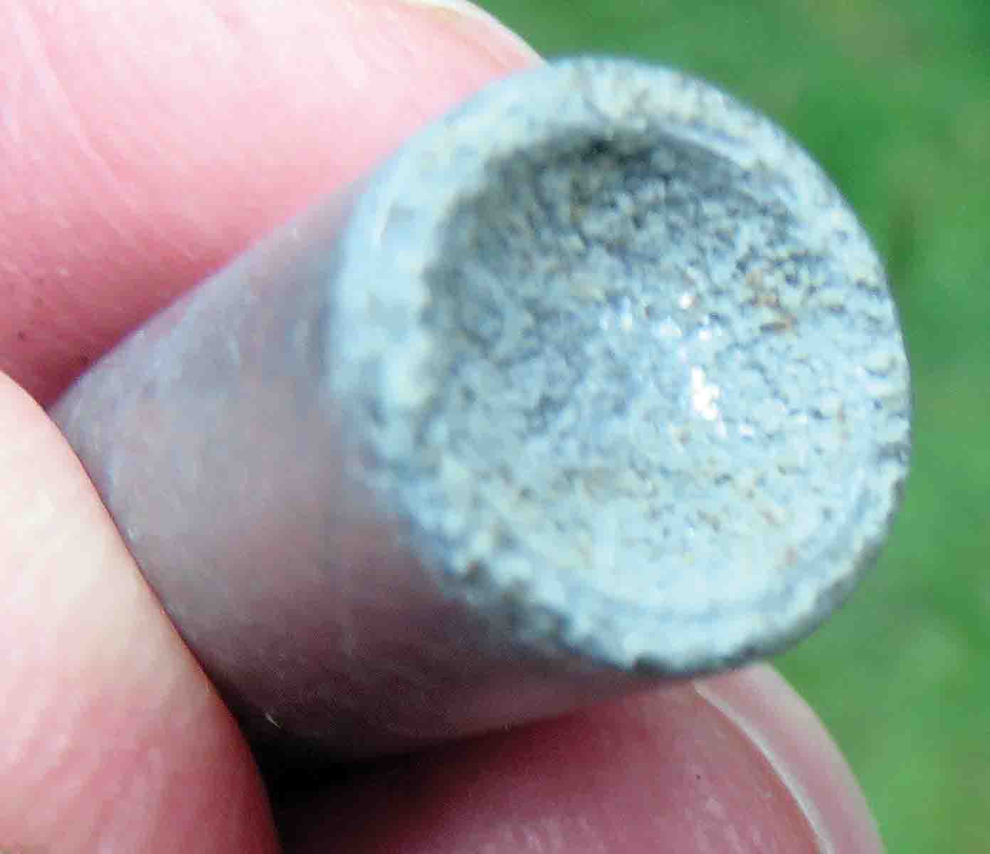 The deep cup base of the .44 bullet, showing its age.